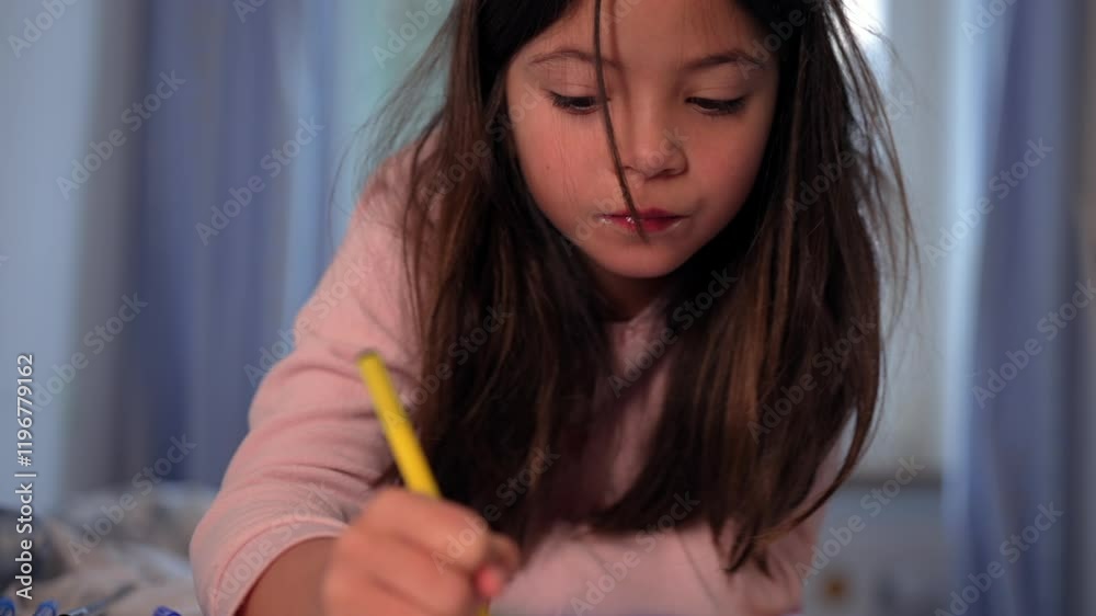 Young Girl Engrossed in Drawing with Yellow Pen, Creative Leisure Activity in Bedroom Young Girl Engrossed in Drawing with Yellow Pen, Creative Leisure Activity in Bedroom