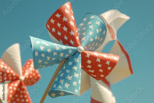 Colorful pinwheels adorned with red, white, and blue patterns spin gently in the summer breeze, celebrating U.S. Independence Day in a joyful atmosphere filled with patriotism