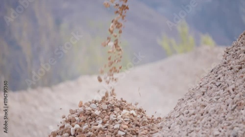 Close-up view about the falling rocks debris in mining quarry until the end. photo