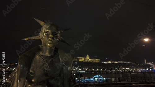 Bronze Little Princess statue on banks of Danube River, Budapest night photo