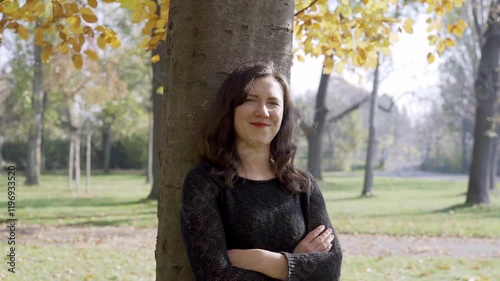 Portrait of cheerful adult cute woman outdoor in the park