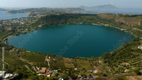 Aerial view of Lake Avernus (Lago d'Averno) located Pozzuoli, near Naples, in Campania, Italy. It is a volcanic crater lake located in Phlegraean Fields (Campi Flegrei). The lake is roughly circular. photo