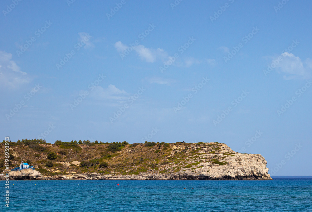 Naklejka premium Mediterranean sea washing the shores of the Kolympia beach on the island of Rhodes, Greece