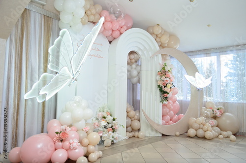 christening photo zone with an arch and butterflies photo