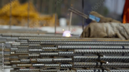 A closeup image shows the detailed stacking of rebar, highlighting key materials for construction projects