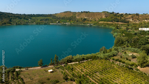 Fototapeta Naklejka Na Ścianę i Meble -  Aerial view of the lakeside of Lago d'Averno located in Pozzuoli, near Naples, Italy. It is a volcanic lake located in the Campi Flegrei. The lake is approximately circular.