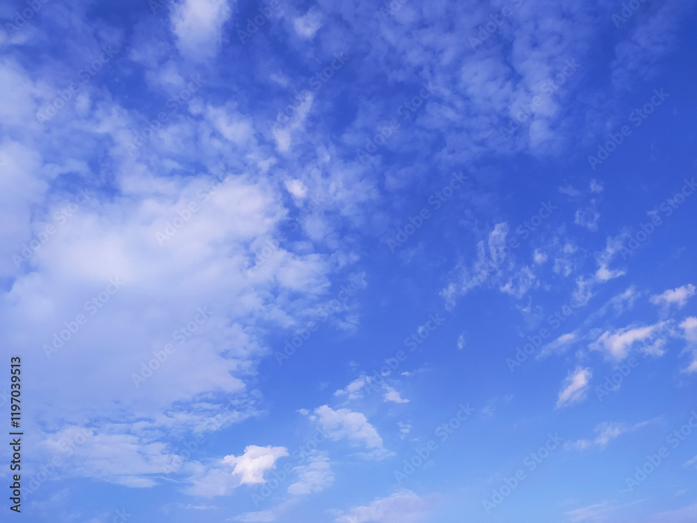 Clear blue sky texture and white fluffy cloud nature background. The sun shines bright in the daytime in summer Clear blue sky texture and white fluffy cloud nature background. The sun shines bright in the daytime in summer
