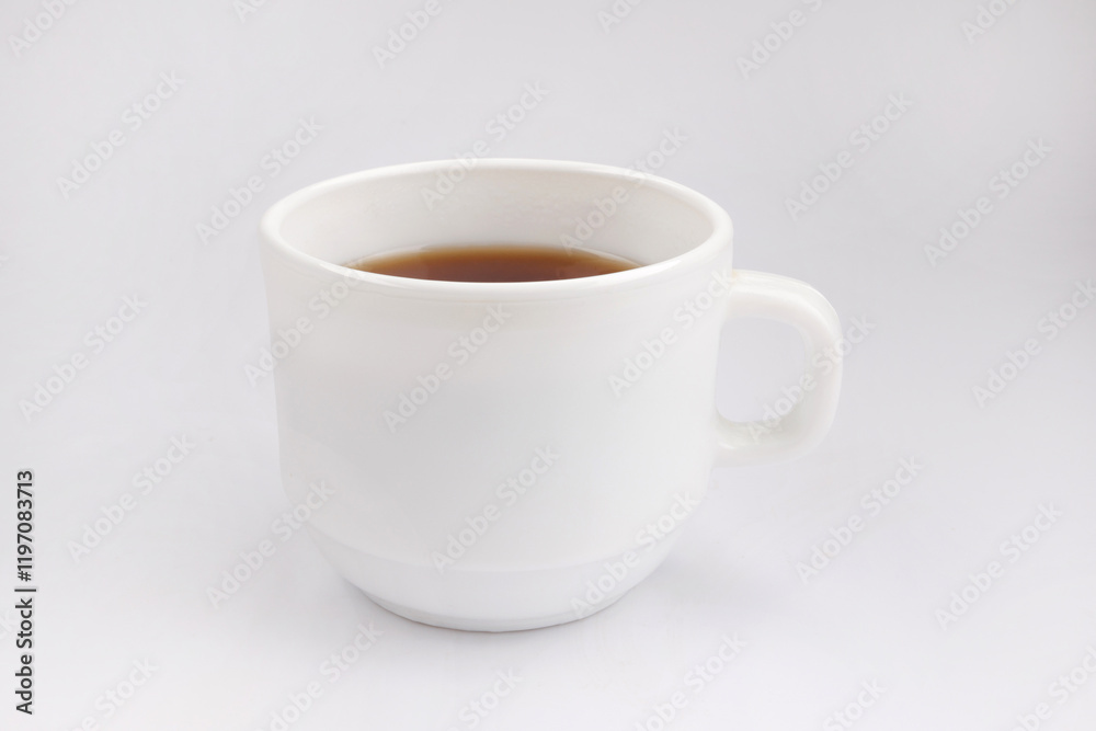 White cup with tea on a white background. White cup with tea on a white background.