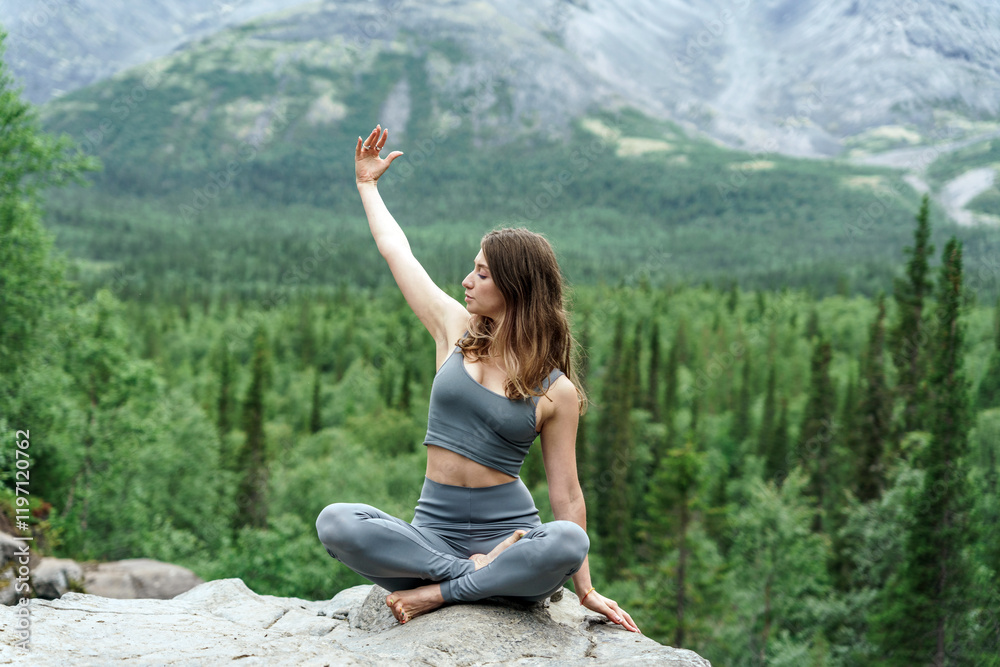 Practicing yoga in a serene mountain landscape surrounded by lush greenery Practicing yoga in a serene mountain landscape surrounded by lush greenery