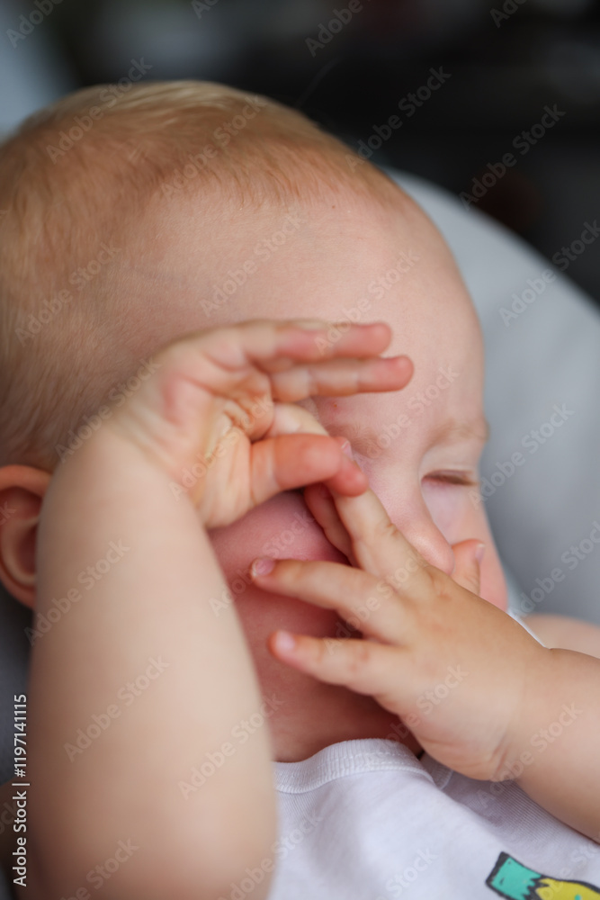 Foreign body fell into the eye of a little child. The baby scratching his eye. Foreign body fell into the eye of a little child. The baby scratching his eye.