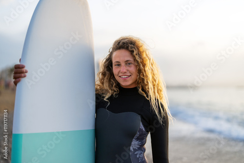 Photography Portrait of a young happy woman, surfing and enjoying summer vacation on the bea