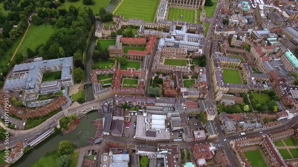 Stunning drone footage of Cambridge University showcasing its iconic architecture, manicured lawns, and the tranquil River Cam winding through historic college buildings.