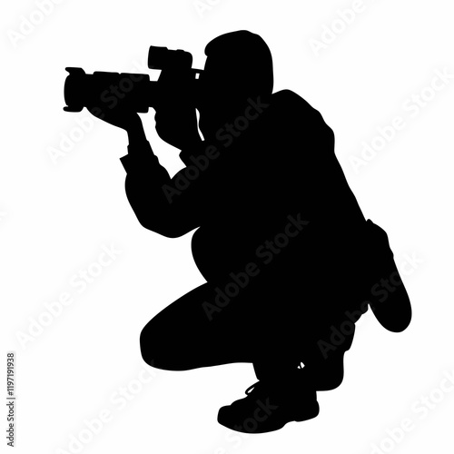A man is crouching down and taking a picture with a camera. He is wearing a backpack