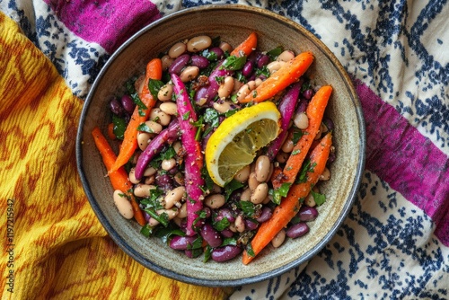 Colorful Bean Salad with Fresh Carrots and Lemon Slice on Plate photo