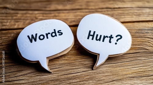 Two speech bubbles on wooden surface with text 