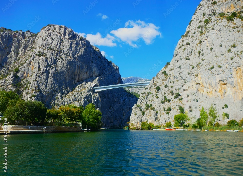 Fototapeta premium Bridge above Cetina river, Omis, Croatia with panoramic view and mountain