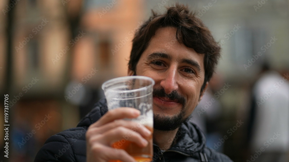Happy casual man drinking beer outside portrait face Happy casual man drinking beer outside portrait face