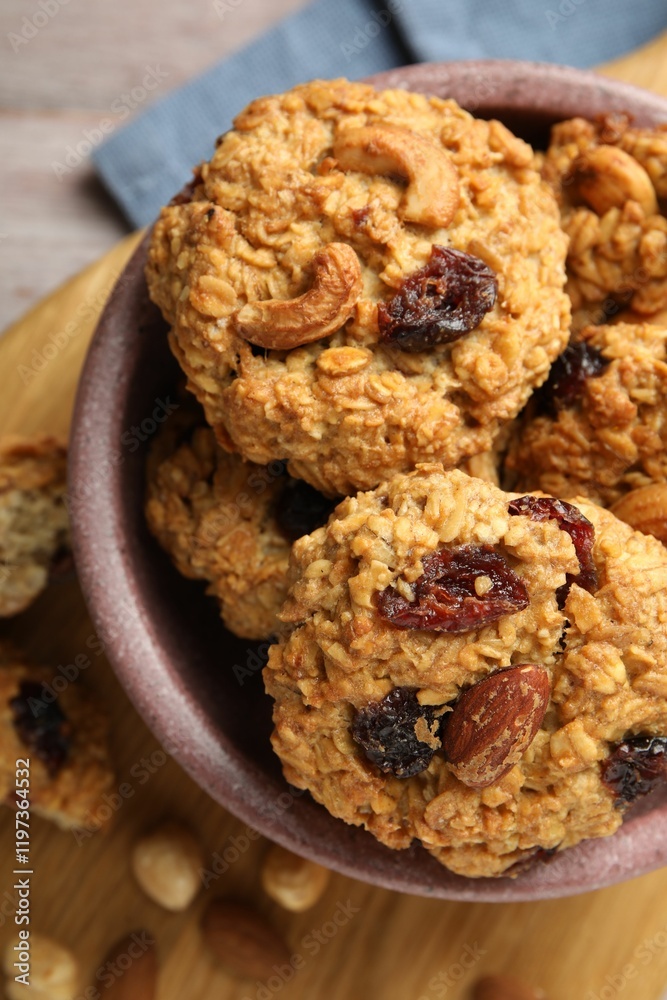 Delicious oatmeal cookies with raisins and nuts on table, top view Delicious oatmeal cookies with raisins and nuts on table, top view