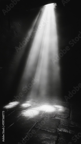 Light beams filter through a doorway into a dark hallway creating a mysteriou...