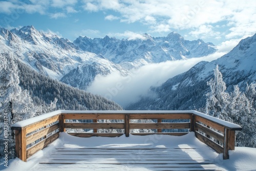 Snowy mountain view from a wooden observation deck in a winter landscape with...