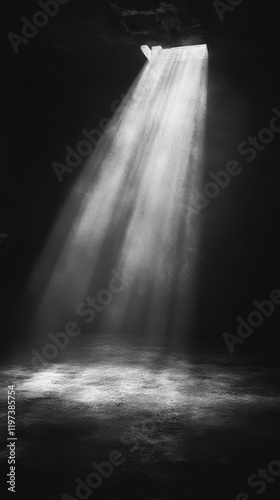 Light beams filter through a doorway into a dark hallway creating a mysteriou...