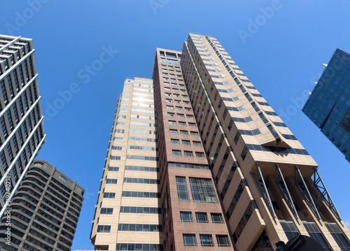 Cape town city skyscrapers against blue sky, high rise office buldings under view. South Africa