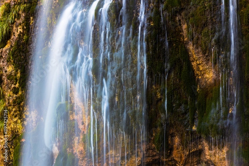 Grunas waterfall 2 km behind the village of Theth in Albania. Theth is a small village in Shkodër county in Albania. It is a protected landscape area