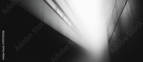Abstract black and white photograph of a narrow alley with fog and light beams creating a dramatic atmosphere Copy Space