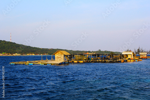 Offshore view of the Karimun Islands, Java, Indonesia with a view of the clear turquoise sea photo
