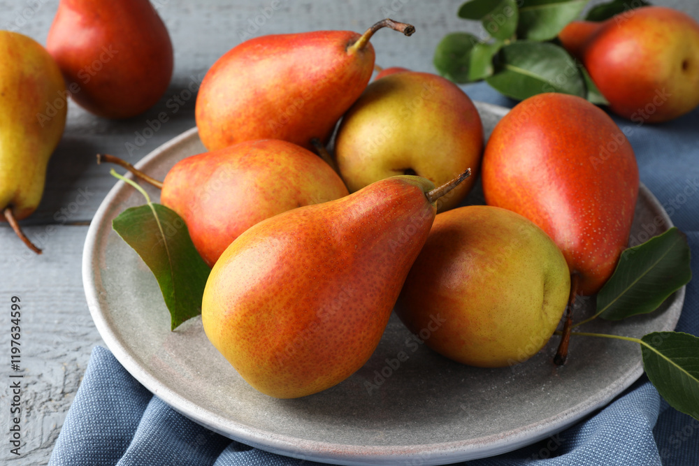 Ripe juicy pears on grey wooden table, closeup Ripe juicy pears on grey wooden table, closeup