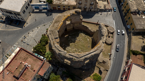 Aerial view of the temple of Venus located in the archaeological park of Baia, a hamlet of Bacoli, in the metropolitan city of Naples, in Campania, Italy. It was an octagonal thermal building.