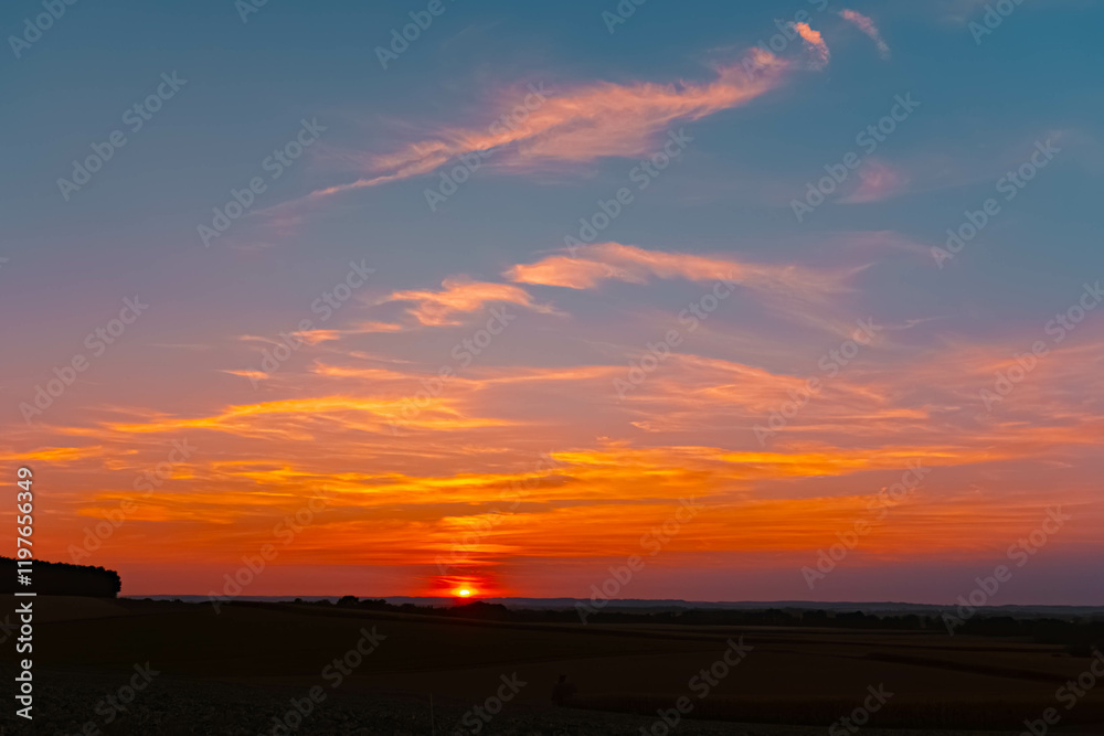 Fototapeta premium Sunset with clouds near Westerndorf, Wallersdorf, Dingolfing-Landau, Bavaria, Germany
