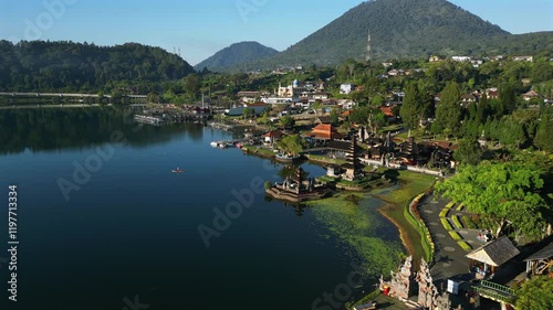 Traditional Balinese Water Temple in Bali in the middle of a lake and mountains. Ulun Danu Beratan