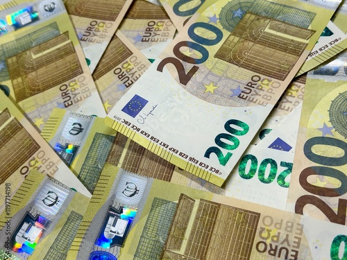 Euro banknotes background, two hundred euro cash pile photo