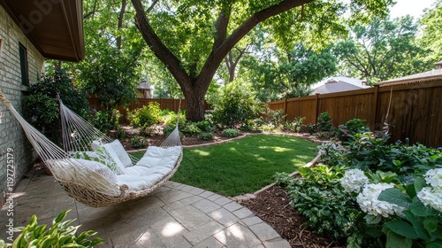 Relaxing hammock in lush backyard garden