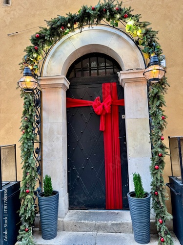 view of a wooden front door with christmas decorations in warsaw old town
 photo