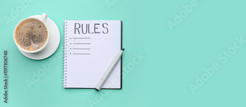 Fotografie Notebook with blank list of rules and coffee cup on green background