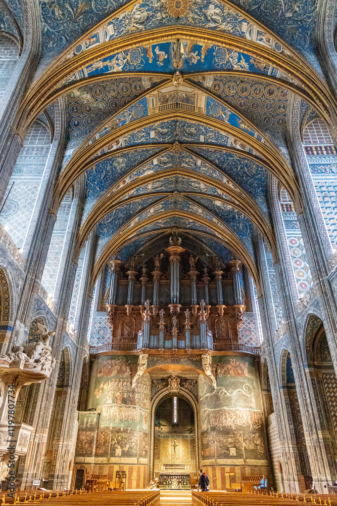 Fototapeta premium Majestic Interior of Sainte-Cecile Cathedral in Albi, France with Ornate Blue Vaulted Ceilings and Historical Murals