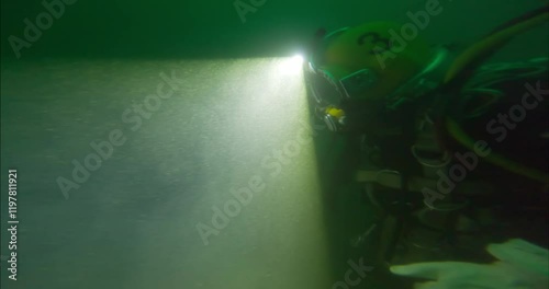 Wallpaper Mural Commercial diver using headlight to navigate closeup Torontodigital.ca