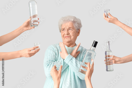 Senior woman rejecting vodk...