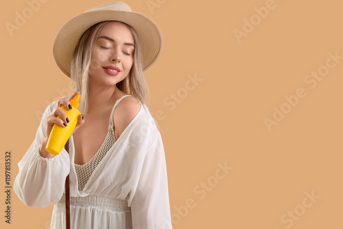 Young woman with sunscreen ...