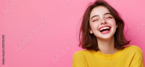 Happy young woman laughing, pink background photo