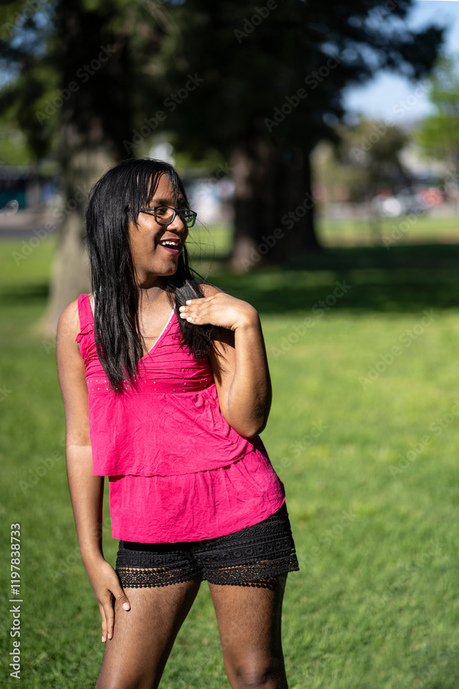 Fototapeta premium Latin transgender woman dancing sensually in a park