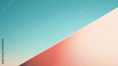 A simple, yet striking diagonal composition of a pink and blue gradient skyline, suggesting endless possibilities and evoking a sense of peacefulness and freedom. photo