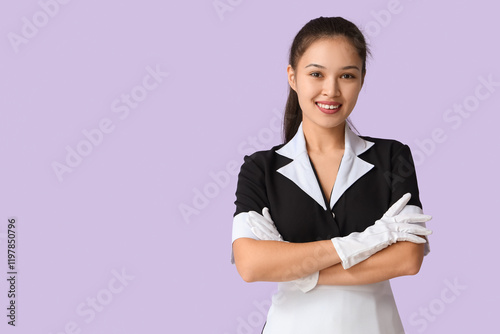 Young Asian chambermaid on ...