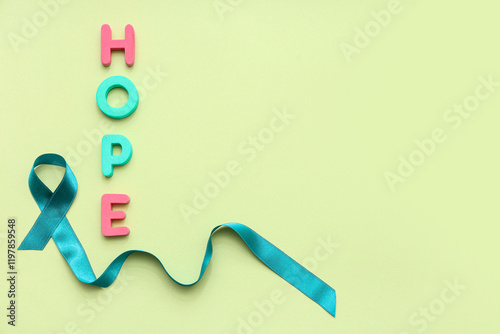 Teal ribbon and word HOPE o...