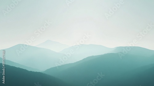 A serene view of calm, misty green mountains basking in hazy morning light, offering a tranquil escape with gentle slopes and a peaceful, ethereal atmosphere. photo