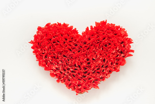 Red heart made of corrugated paper. Handmade red heart. Background of red hearts. Valentine's Day background.