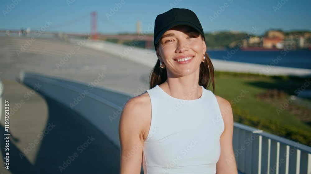 Energetic sportswoman walking street after outdoors fitness routine closeup. Energetic sportswoman walking street after outdoors fitness routine closeup.