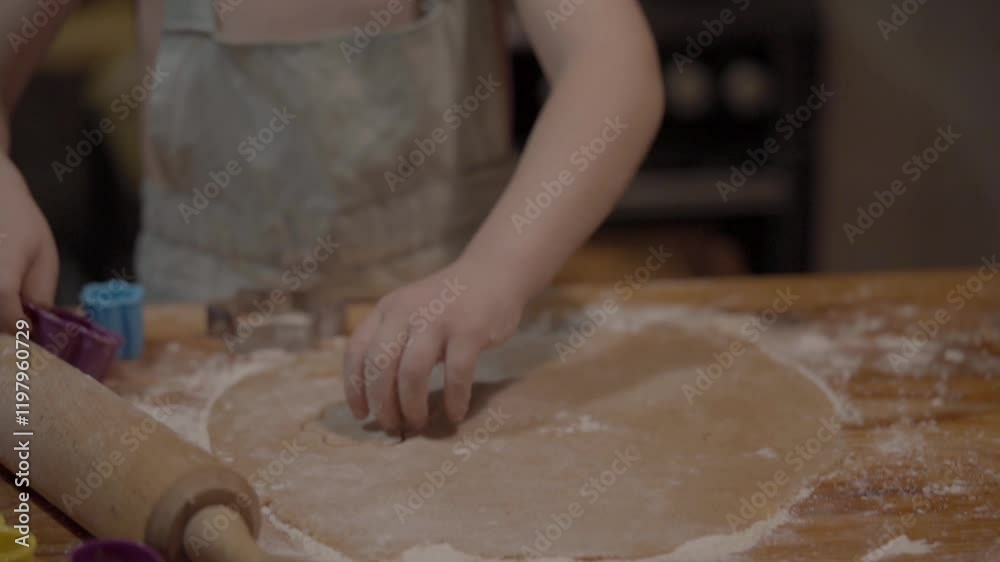 Baking cookies in a cozy kitchen with rolling dough and colorful cutters Baking cookies in a cozy kitchen with rolling dough and colorful cutters